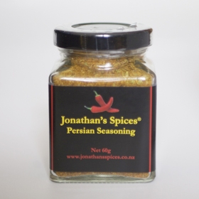 A square shaped glass jar with a black, red and yellow label containing Jonathan's Spices persian seasoning